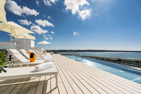 Seasonal outdoor pool, pool umbrellas, sun loungers