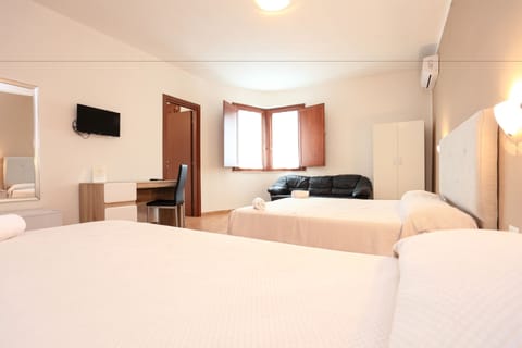 Superior Triple Room, Sea View | Minibar, in-room safe, desk, soundproofing