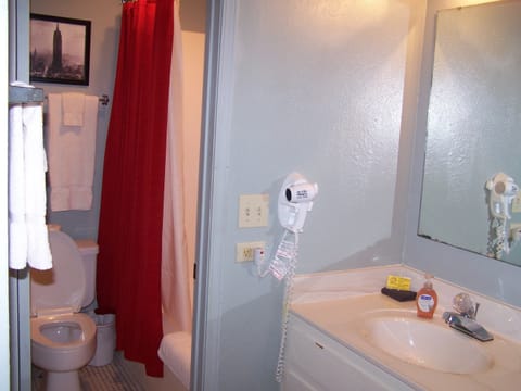 Family Room, 2 Queen Beds | Bathroom | Combined shower/tub, hair dryer, towels, soap