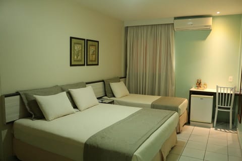 Deluxe Triple Room, Multiple Beds | Minibar, in-room safe, blackout drapes, free WiFi