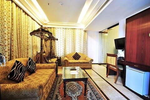 Suite, Accessible, City View | Living room | 32-inch LCD TV with satellite channels, TV