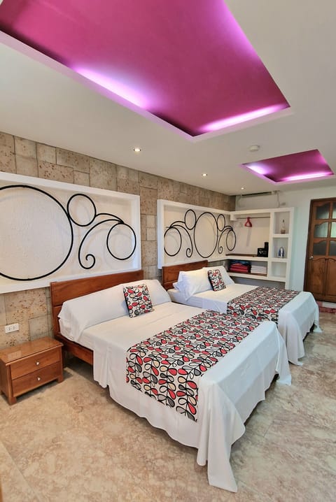 Exclusive Quadruple Room, 2 Queen Beds, Garden View | Hypo-allergenic bedding, down comforters, in-room safe