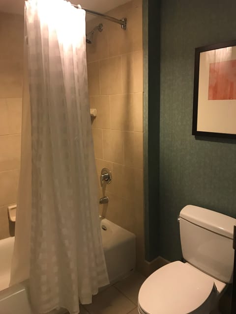 Combined shower/tub, designer toiletries, hair dryer, towels