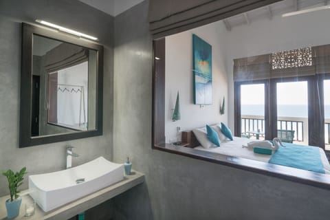 Room, 1 King Bed, Sea View | Bathroom | Shower, rainfall showerhead, towels