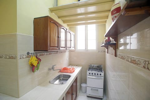 Family Apartment, Multiple Beds | Private kitchen | Fridge, microwave, stovetop, cookware/dishes/utensils