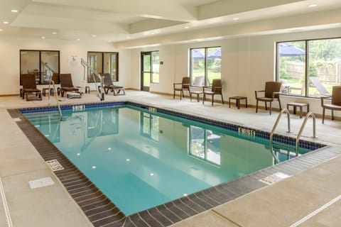 Indoor pool, open 6:00 AM to 10:00 PM, pool umbrellas, sun loungers