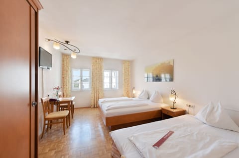 Standard Triple Room, City View | Individually decorated, desk, free WiFi, bed sheets