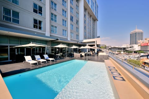 Outdoor pool, pool umbrellas, sun loungers