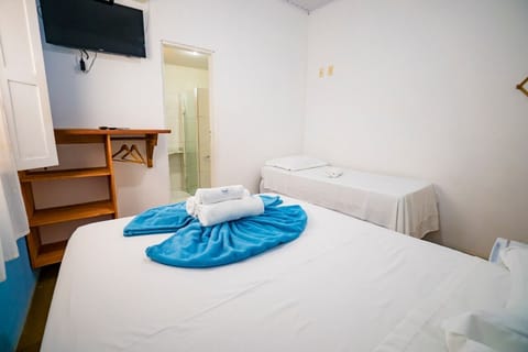 Family Triple Room, City View | Minibar, iron/ironing board, free WiFi, bed sheets