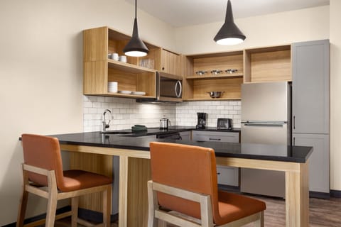 Standard Suite, 1 King Bed, Transfer Shower (Communications, Mobility) | Private kitchenette | Full-size fridge, microwave, stovetop, dishwasher