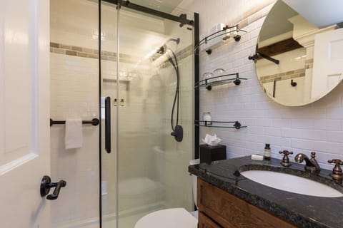 Squamscott Room | Bathroom | Rainfall showerhead, designer toiletries, hair dryer, bathrobes