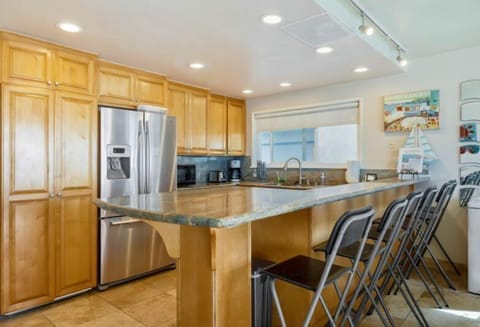 Unit 2 Kitchen with large bar & bar stools