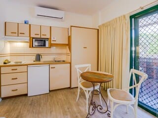 Deluxe Studio, 1 Queen Bed, Pool View - Not Pet Friendly | Private kitchen | Electric kettle, toaster, blender, griddle