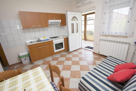 Apartment, Balcony | Private kitchen | Fridge, stovetop, coffee/tea maker, electric kettle