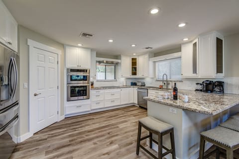 Completely Renovated Kitchen with New Stainless Steel Appliances, Granite Counters and Kitchen Bar Seating