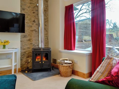 Cosy living area with wood burner | The Old Inverchroskie Kennels - Inverchroskie, Enochdhu, near Pitlochry