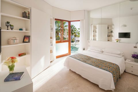 Family Triple Room, Terrace, Partial Sea View | Premium bedding, minibar, in-room safe, desk