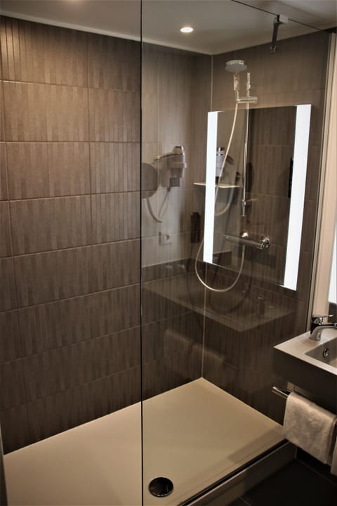 Shower, eco-friendly toiletries, hair dryer, towels