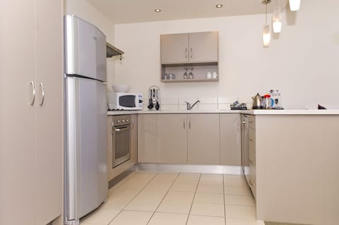 Apartment, 2 Bedrooms | Private kitchen | Fridge, microwave, stovetop, coffee/tea maker