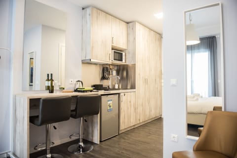 City Studio, 1 King Bed | Private kitchenette | Fridge, microwave, stovetop, espresso maker