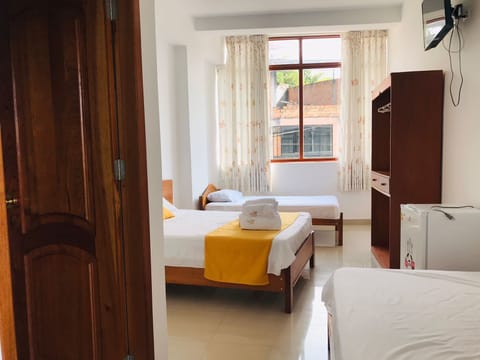 Family Triple Room, Multiple Beds (Air Conditioner) | Minibar, in-room safe, free WiFi, bed sheets