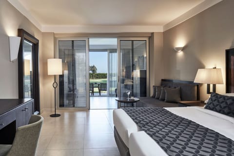 Junior Suite, Sea View | Premium bedding, free minibar items, in-room safe, desk