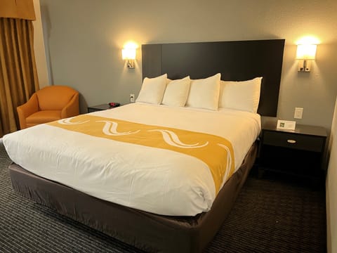 Premium bedding, down comforters, blackout drapes, iron/ironing board