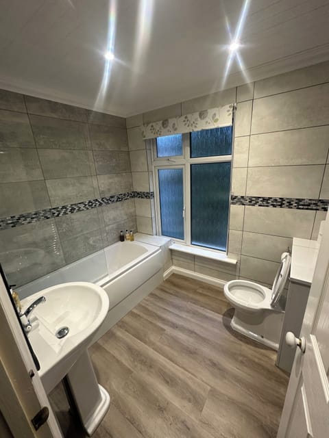 Family Room | Bathroom | Shower, deep soaking tub, free toiletries, hair dryer