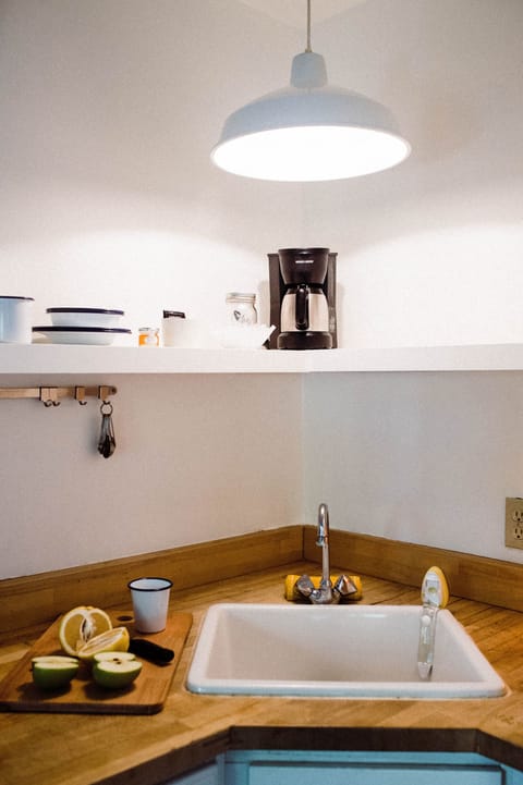 Deluxe King w/patio (Room 5) | Private kitchen | Coffee/tea maker