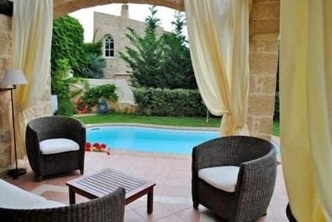 garden and swimming pool view from the veranda.