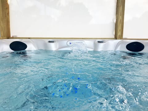 Has a little waterfall and multiple light displays. Very cool at night!