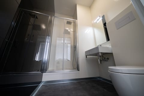 Standard Double Room, City View | Bathroom | Shower, free toiletries, hair dryer, slippers