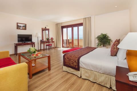 Deluxe Suite, Sea View | Living area | 32-inch LCD TV with cable channels, TV