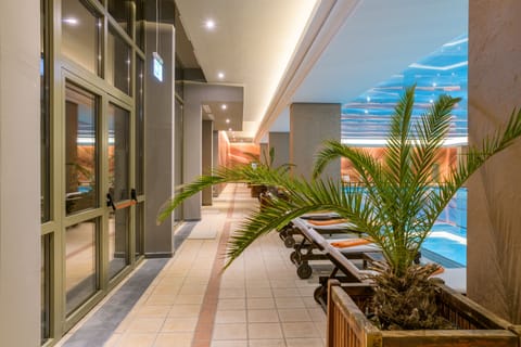 Indoor pool, seasonal outdoor pool, pool umbrellas, sun loungers