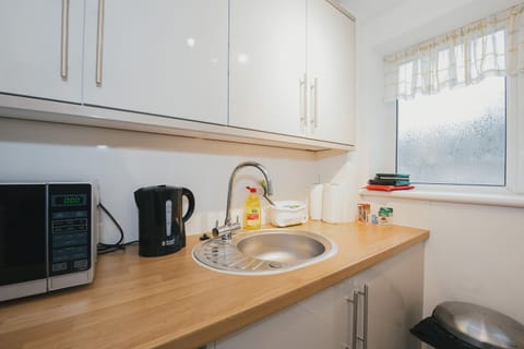 Comfort Room, 1 Double Bed with Sofa bed | Private kitchen | Full-size fridge, microwave, oven, stovetop