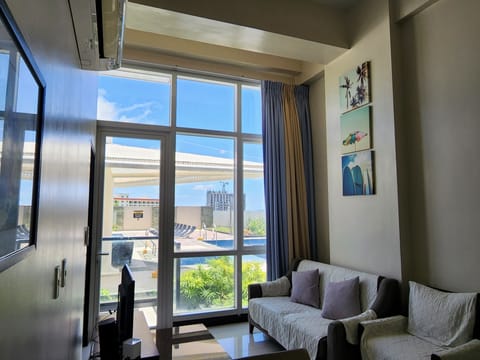 One Pacific Residences 1B | Living area | 32-inch flat-screen TV with cable channels, TV, Netflix