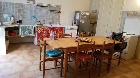 Kitchen-tall pantry has 5 L containers for purchasing wine at the Cooperative!