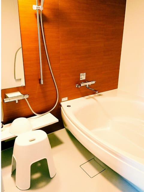 Family Quadruple Room | Bathroom | Separate tub and shower, deep soaking tub, free toiletries, hair dryer