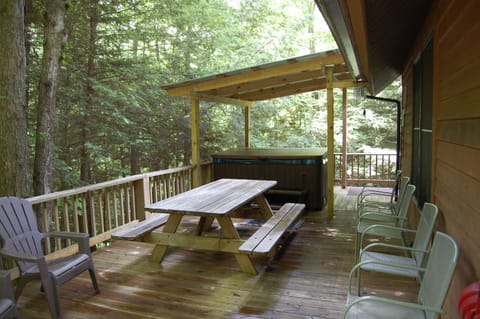 covered hot tub in the treetops