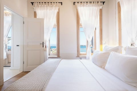Deluxe Room, Balcony, Sea View | 1 bedroom, in-room safe, individually decorated, individually furnished