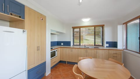 Courtyard Suite | Private kitchen | Full-size fridge, microwave, stovetop, coffee/tea maker