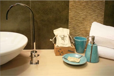 Junior Quadruple Room, Garden View (Dependance, Separate Building) | Bathroom amenities | Shower, hair dryer, slippers, bidet