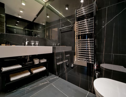 Design Room | Bathroom | Hair dryer, slippers, towels, toilet paper