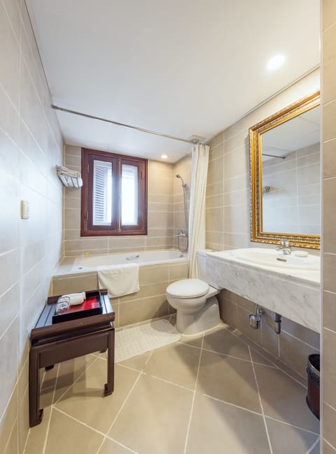 Premium Suite, 1 King Bed, Jetted Tub, City View | Bathroom | Jetted tub, rainfall showerhead, designer toiletries, hair dryer