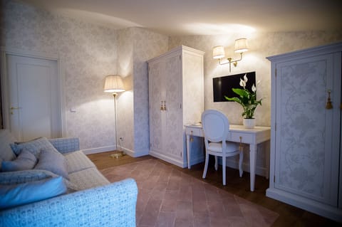 Superior Quadruple Room, 1 King Bed with Sofa bed | Living area | Smart TV