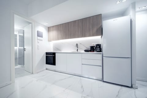 Luxury Apartment, 2 Bedrooms (H404) | Private kitchen | Full-size fridge, oven, stovetop, coffee/tea maker