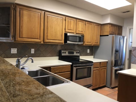 Kitchen with double door fridge with ice maker