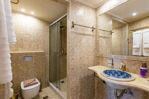 Superior Duplex, Balcony, Pool View | Bathroom | Shower, hair dryer, towels, toilet paper