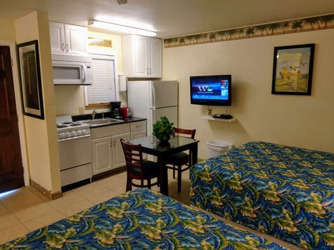 Standard Room, 2 Queen Beds, Non Smoking, Kitchenette | Living area | 32-inch flat-screen TV with cable channels, TV