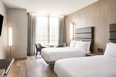 Room, 2 Double Beds | 2 bedrooms, hypo-allergenic bedding, down comforters, in-room safe